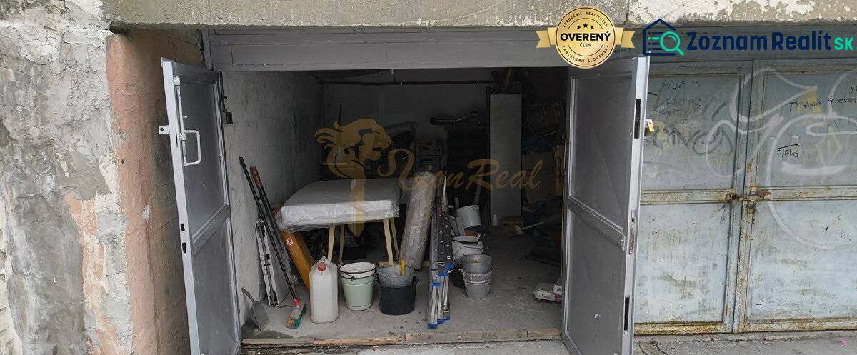 An open garage on Dudvážska Street in Bratislava - Podunajské Biskupice, full of tools and materials.