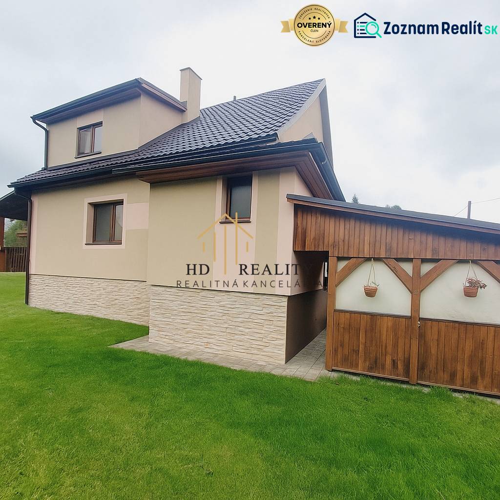 A family house in Liptovská Porúbka with a new roof and lawn.