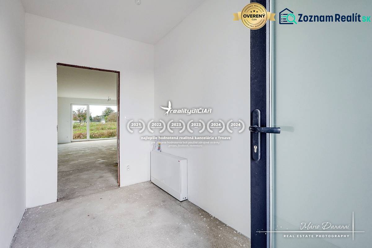 Interior of a family house with a bright room and a view of the garden.