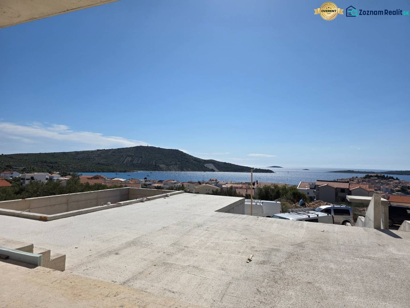 View from the terrace to the sea in Primošten, overlooking the rooftops and landscape.