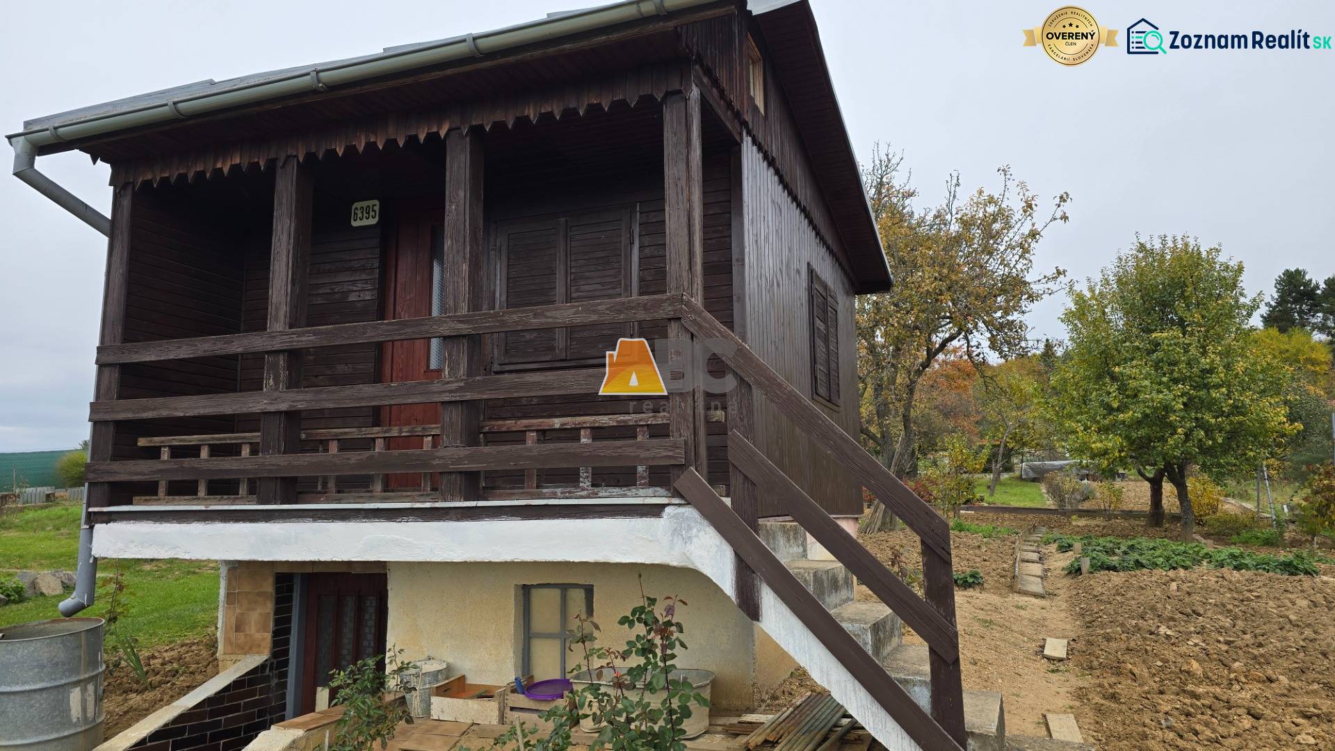 Wooden cottage with a garden and trees on A. Hlinka Street in Zvolen.