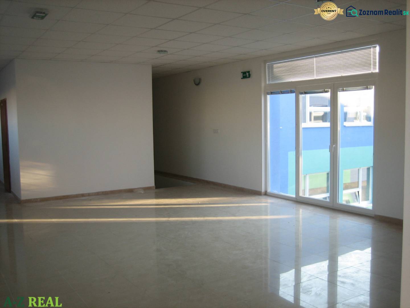 Bright office spaces with tiles and large windows.