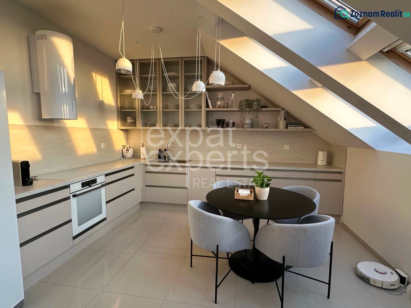 Bright kitchen with a dining table in a 3-room apartment, cozy attic.