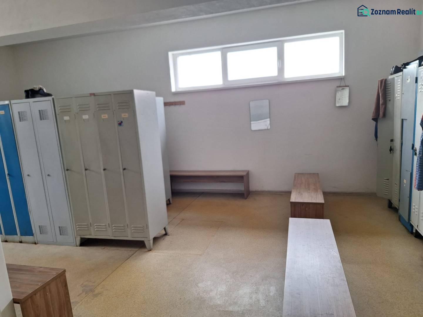 Locker room with lockers and benches in warehouses and halls, simple interior.
