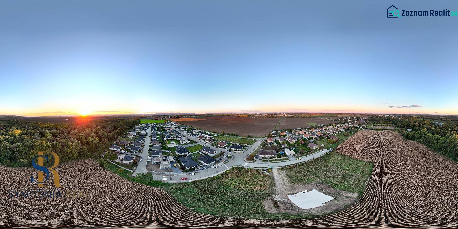 Panoramic view of residential plots around Voderady, with a view of the fields.