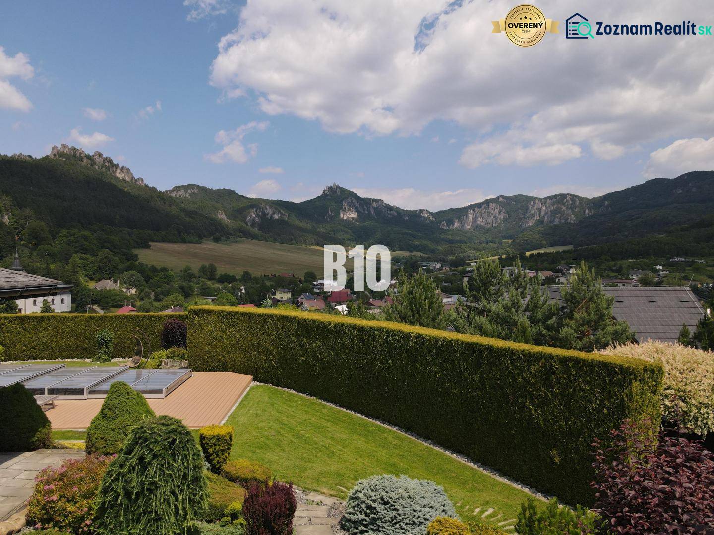 View from the villa in Súľov-Hradná of the hilly landscape and greenery in the garden.