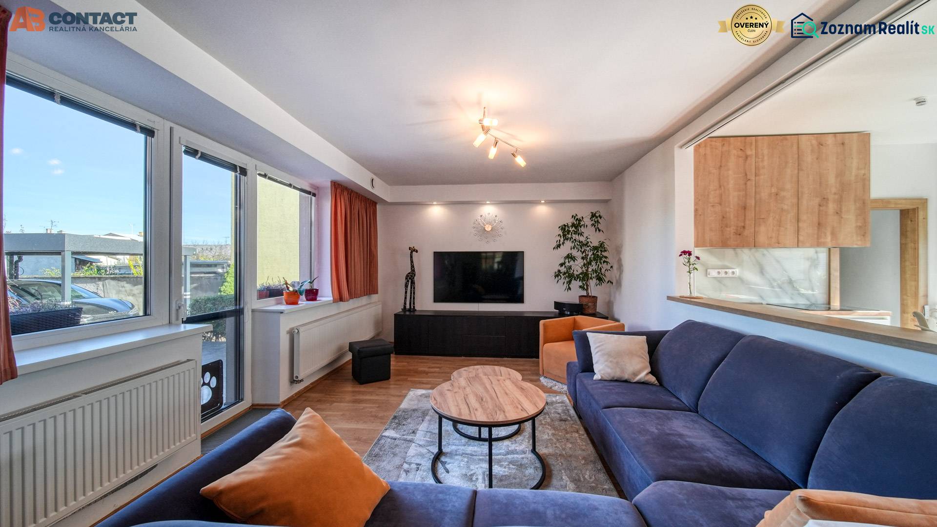 Living room in a family house, comfortable sofa, table and television, floor with wooden decor.