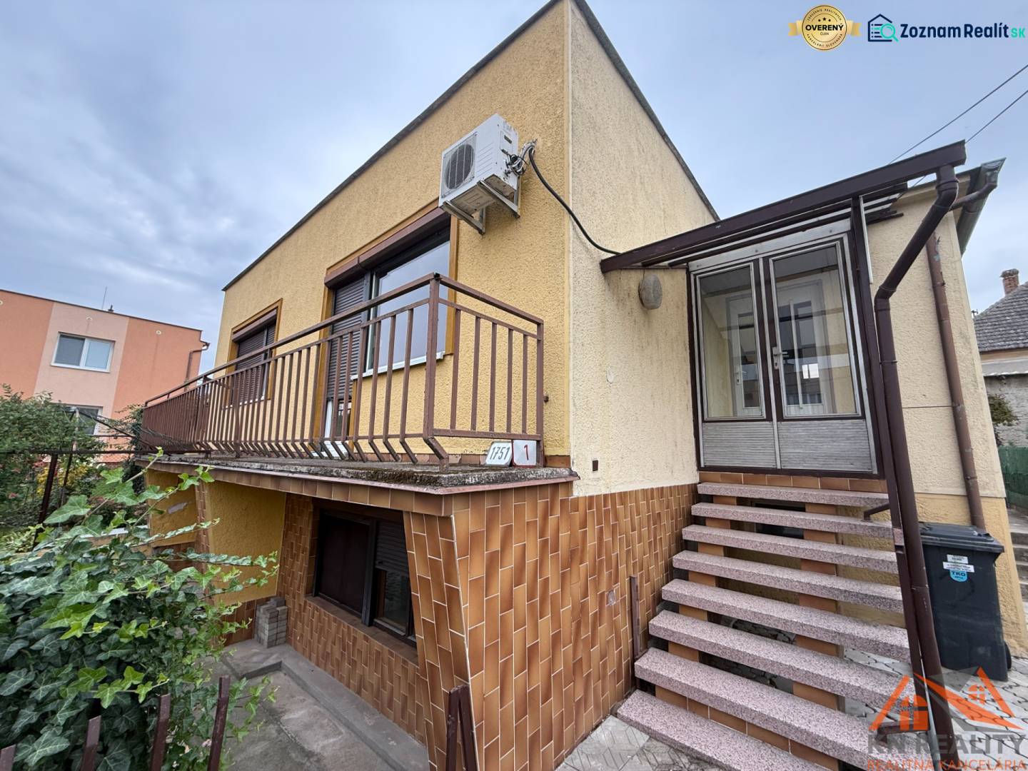 A family house on Jilemnického Street in Dvory nad Žitavou with external stairs and a balcony.