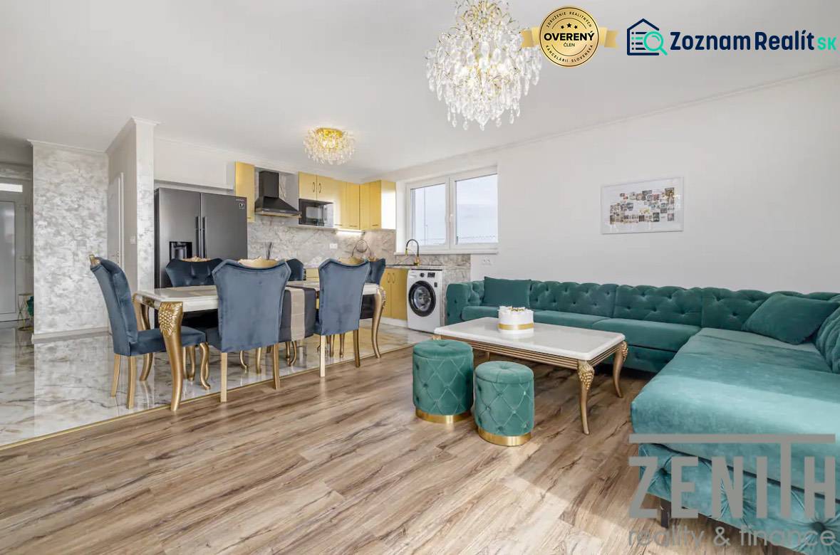 Living room in a family house with a wooden decor floor and luxurious furnishings.