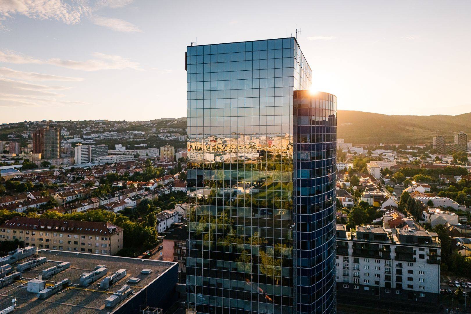 Panorama of Bratislava with the reflection of the city on a glass building, view from Vajnorská Street.