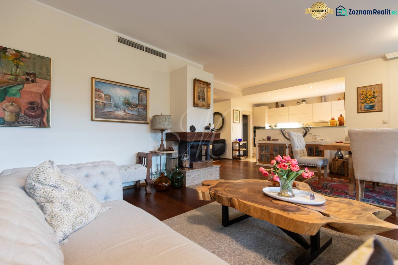 A stylish living space with a sofa, floral decoration, and furniture in a 3-room apartment.