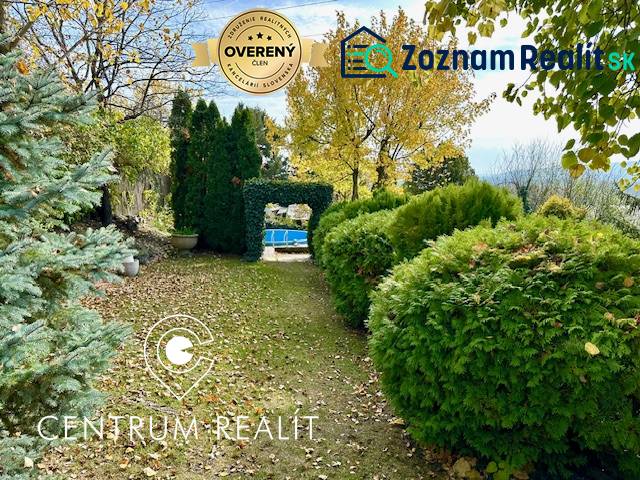 A garden with ornamental shrubs and trees on a residential plot on Hany Meličkovej, Bratislava - Karlova Ves.