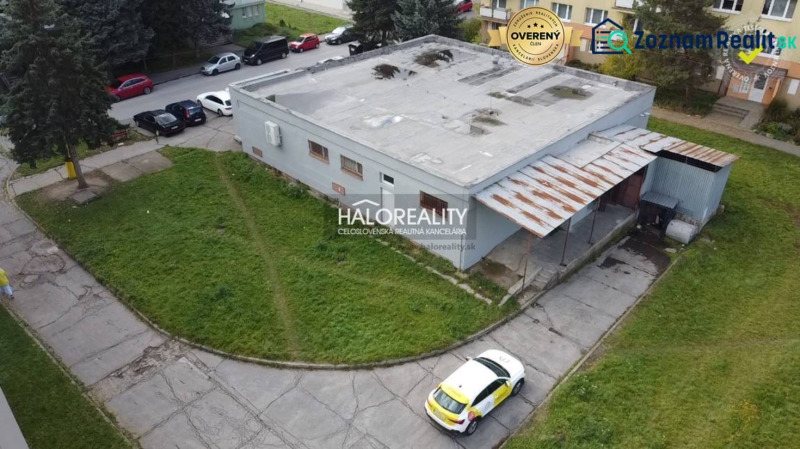 Commercial premises in Rimavská Sobota with surrounding greenery and parking lot.