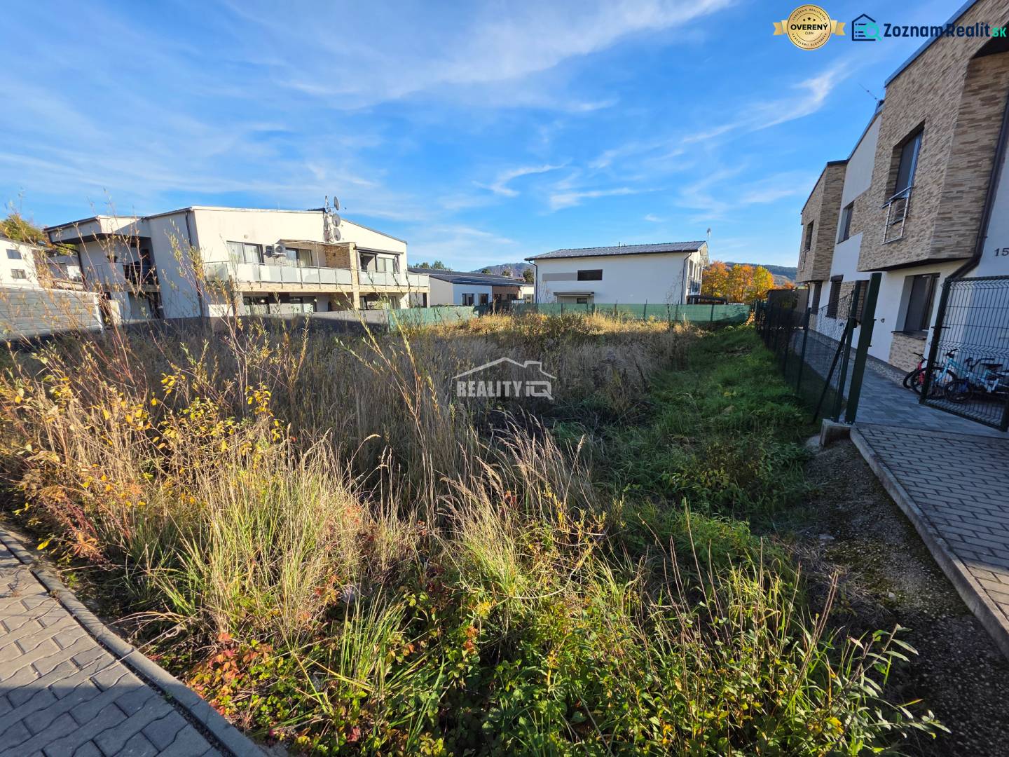 Residential land in Bytča with buildings and paved area.
