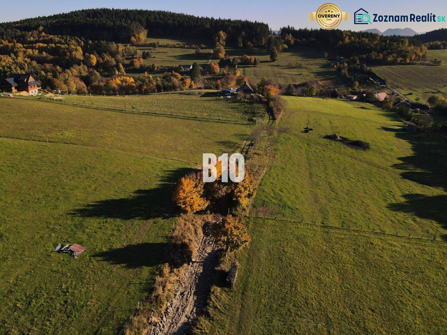 Greenery and meadows in Pozemky - living in Petrovce, surrounded by trees and hills.