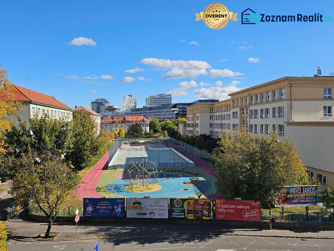 Playground and sports field in Bratislava - Ružinov, on Košická Street surrounded by buildings.