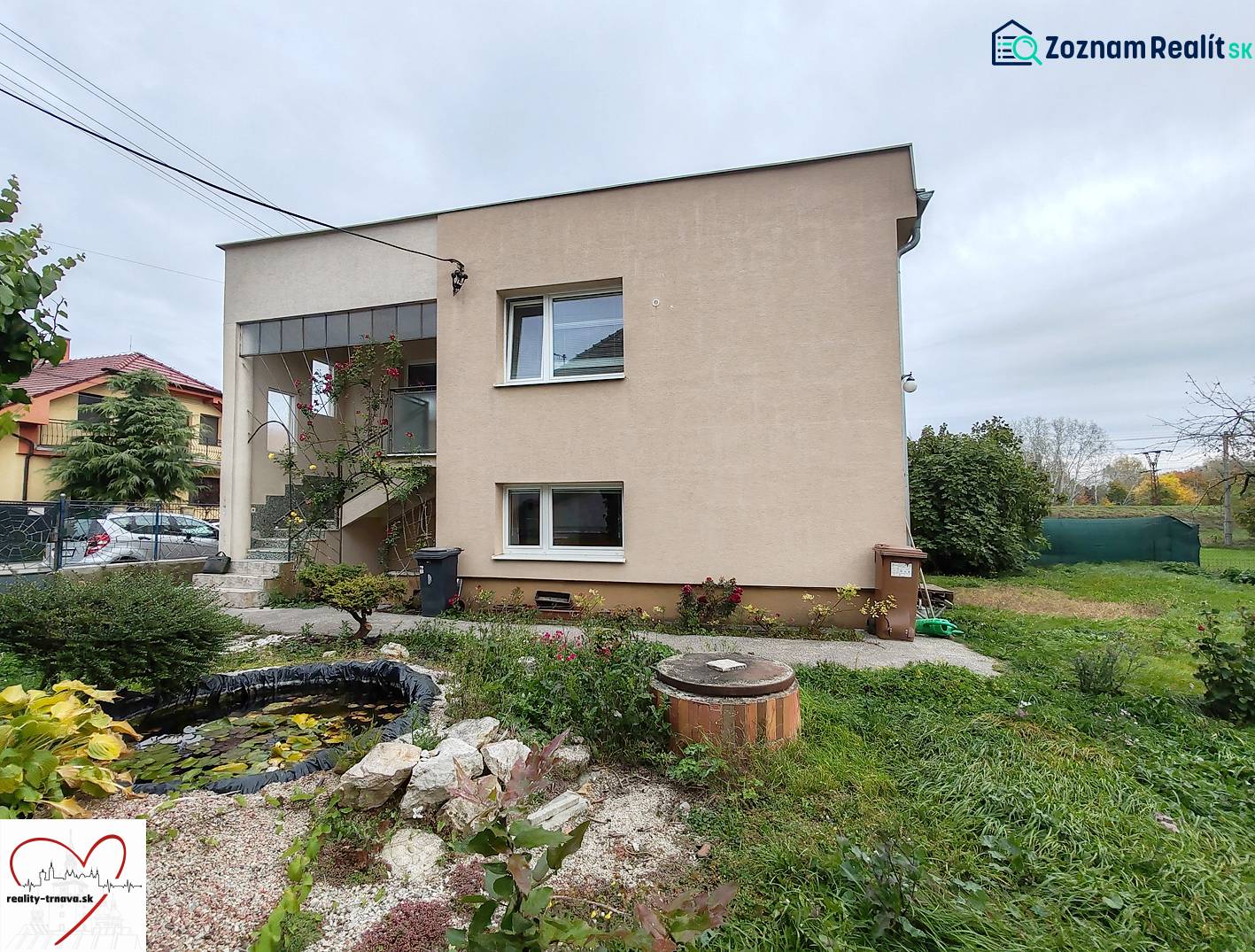 A family house on Topoľová Street in Sereď with a decorative garden and a pond.