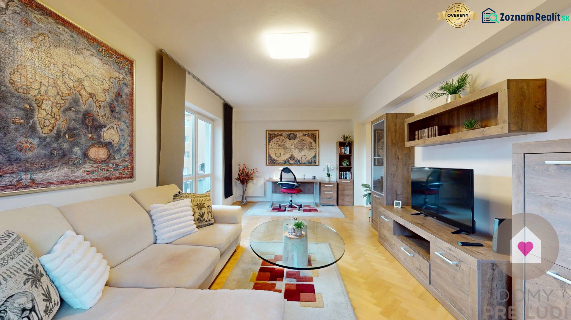 Living room in a two-room apartment with a map on the wall and a floor with a wooden decor.