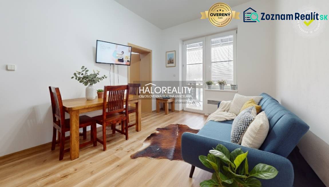 A kitchen unit with a marble decor and appliances in a 3-room apartment.