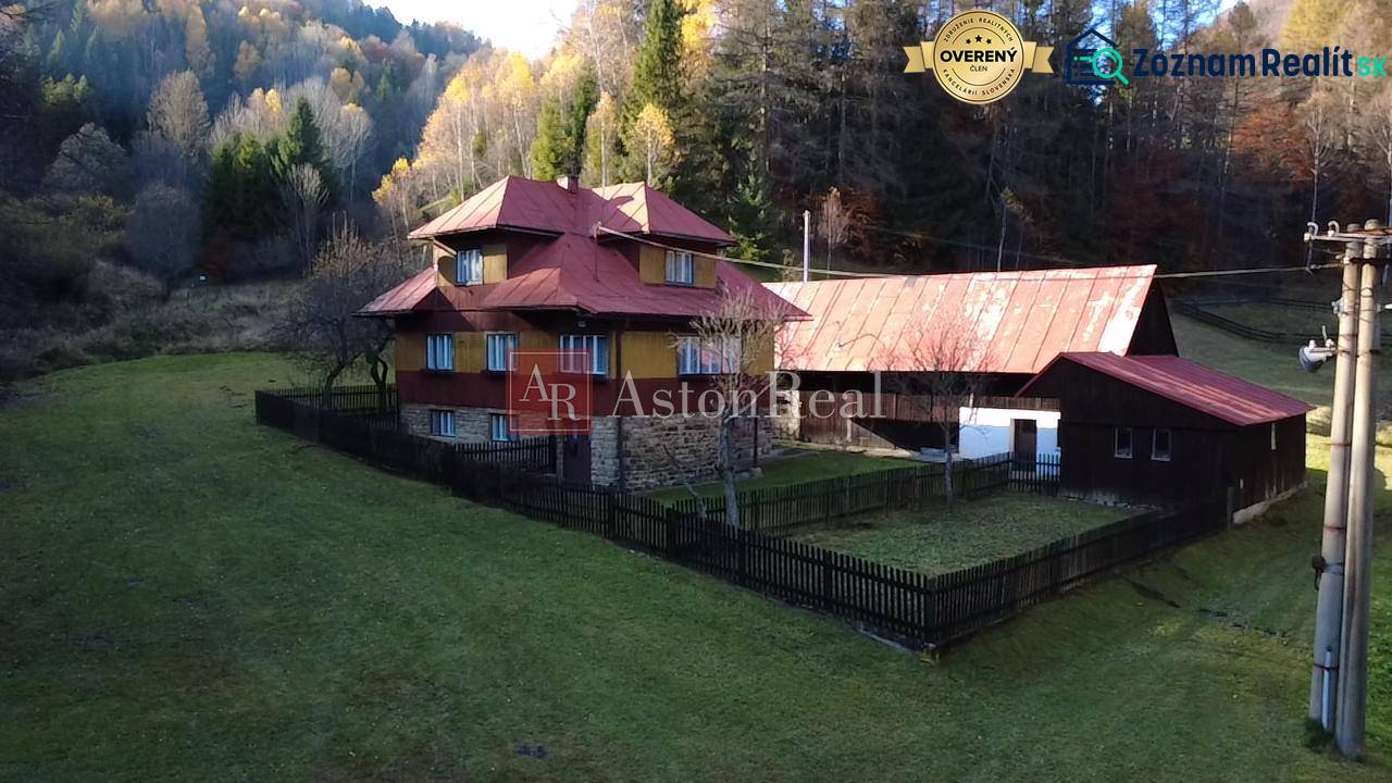 A family house in Zázrivá surrounded by nature and forests, with a large yard space.