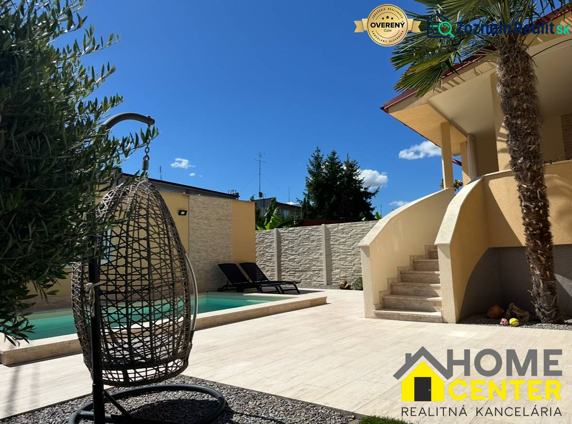 Family house in Komárno, exterior with garden, swimming pool, and relaxation corner.