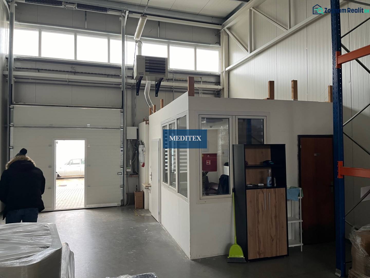 Interior of warehouses and halls with a transition gate and a small office on top.