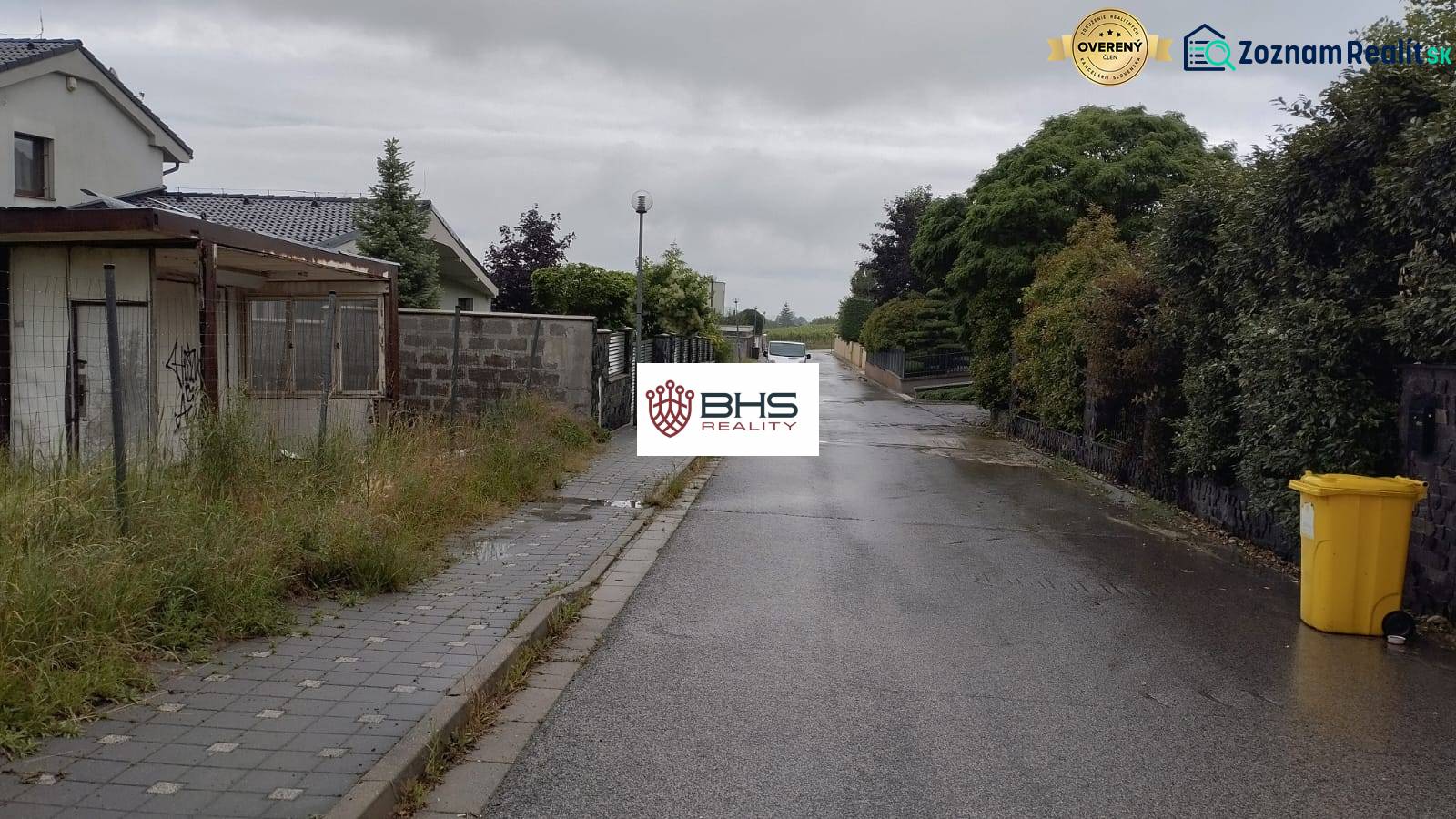 Street in Limbach with houses and a sidewalk, suitable for residential plots.