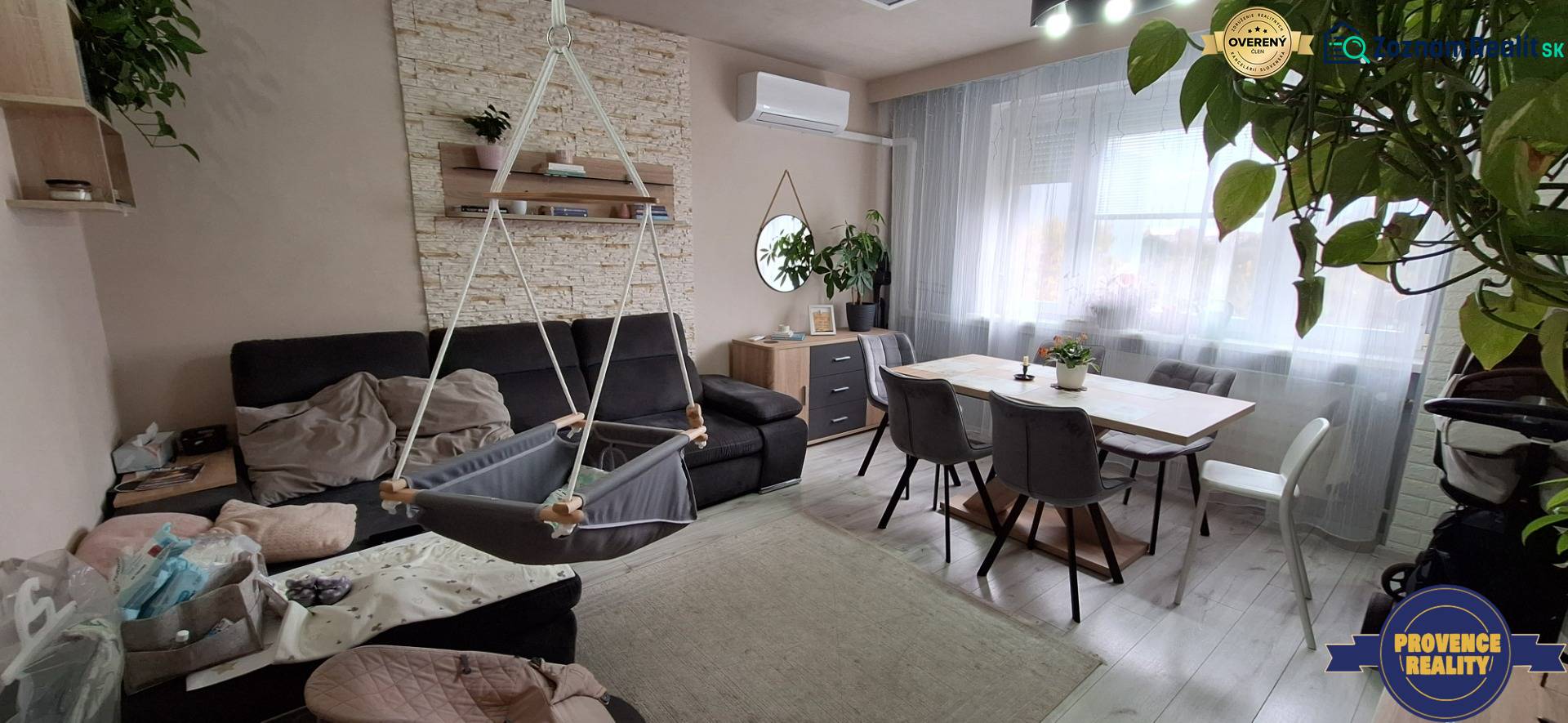 Living room in a 3-room apartment with a sofa, swing, and dining table.