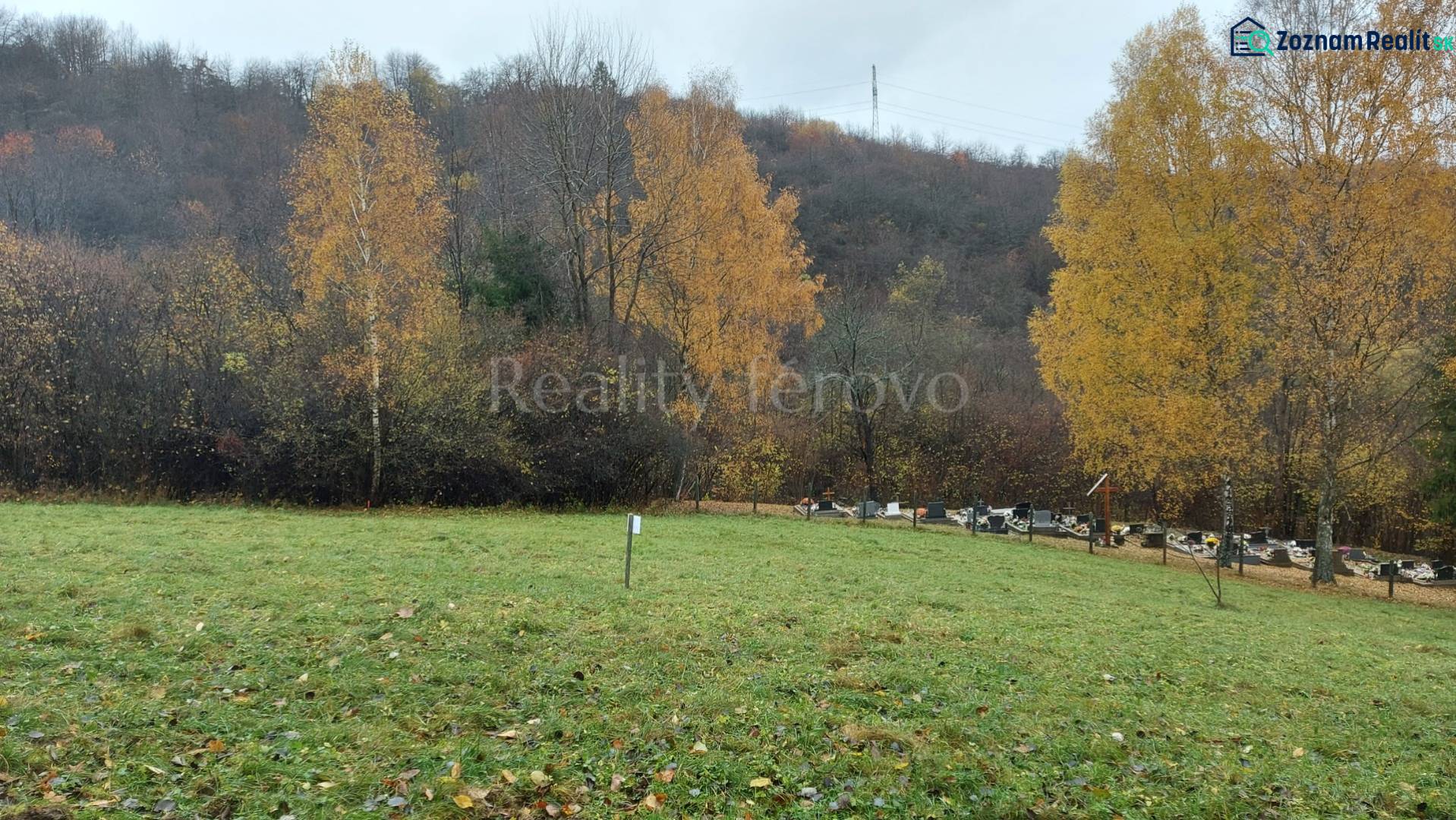 Autumn at the recreational grounds in Konské pod Podhradím with forest and greenery on the hill.