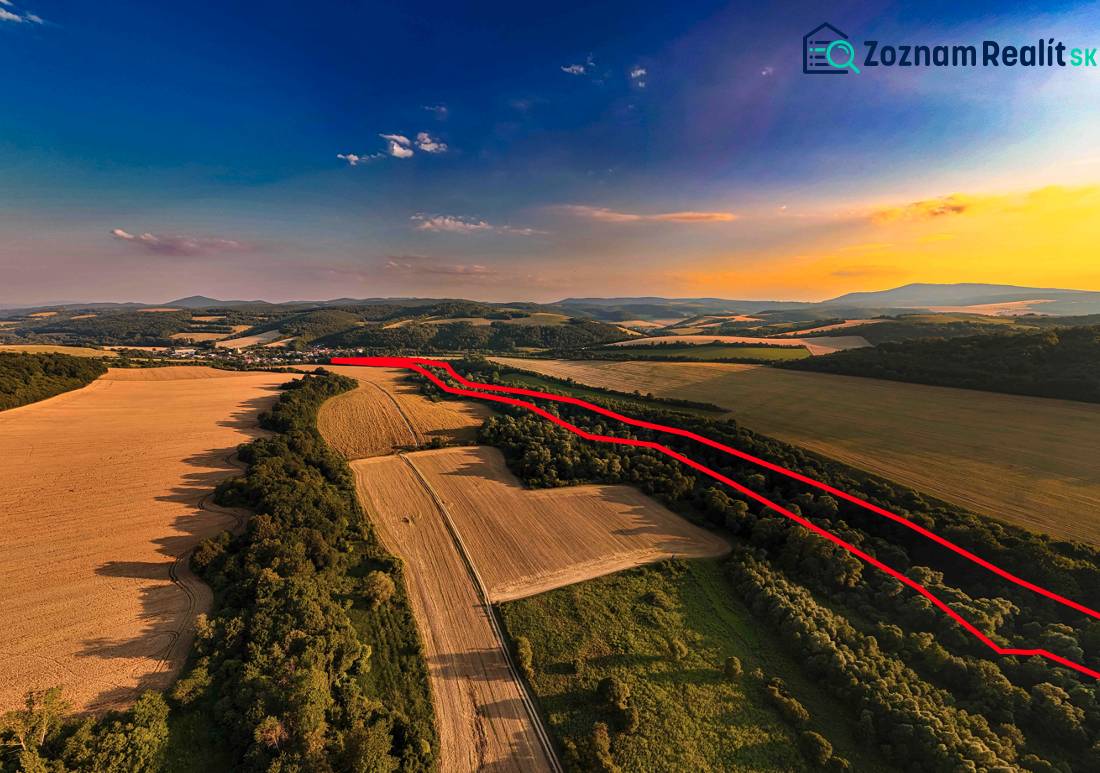 Agricultural and forest lands in Rokycany at sunset, with a visible red line.