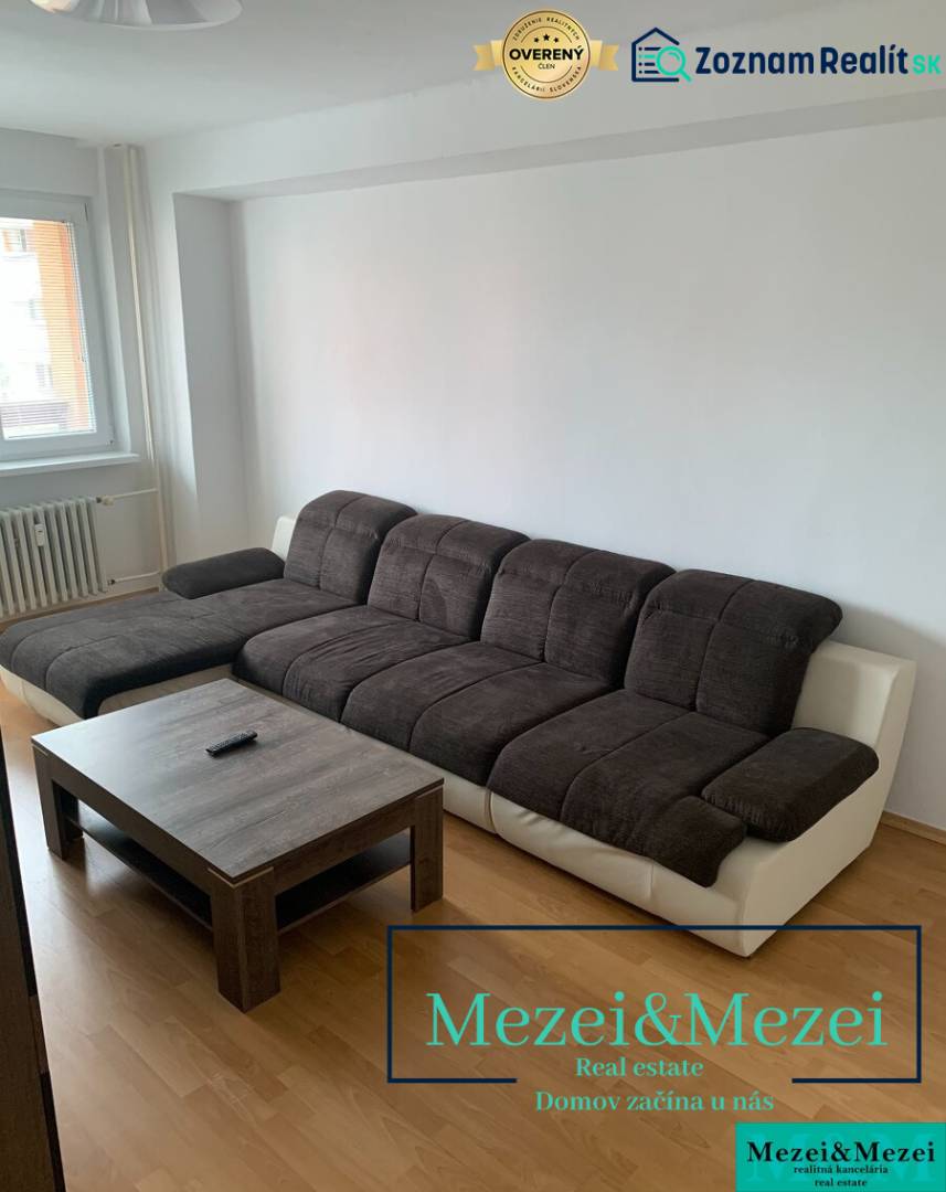 A sofa set with a coffee table in a 2-room apartment, floor with wooden decor.