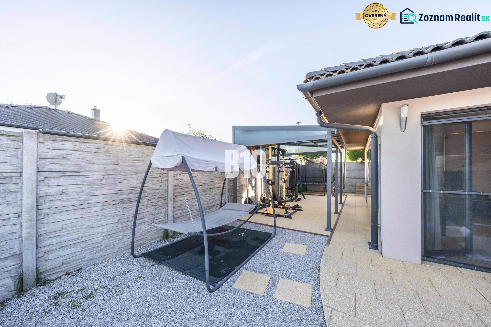 A family house in Most pri Bratislave with a terrace, an outdoor gym, and a swing.