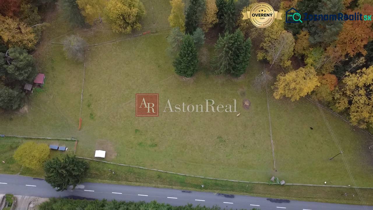 Recreational plots in Lazy pod Makytou, Čertov surrounded by trees and an access asphalt road.