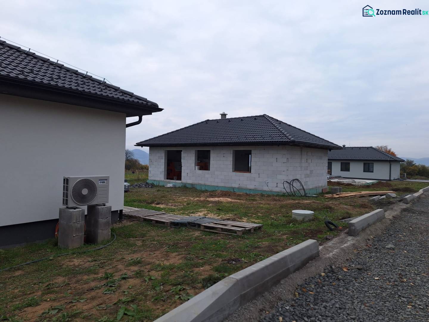 A family house in Vyšná Šebastová, Prešov, under construction, with dark roof tiles.