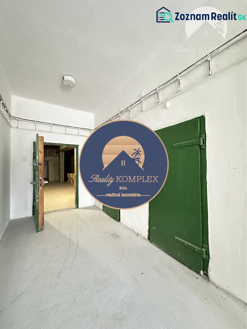 Commercial premises with white walls and green doors, entrance door.