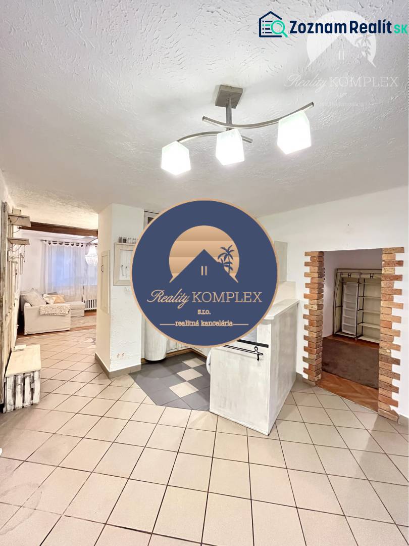 Open space of a 3-room apartment with tiles and a bright interior.