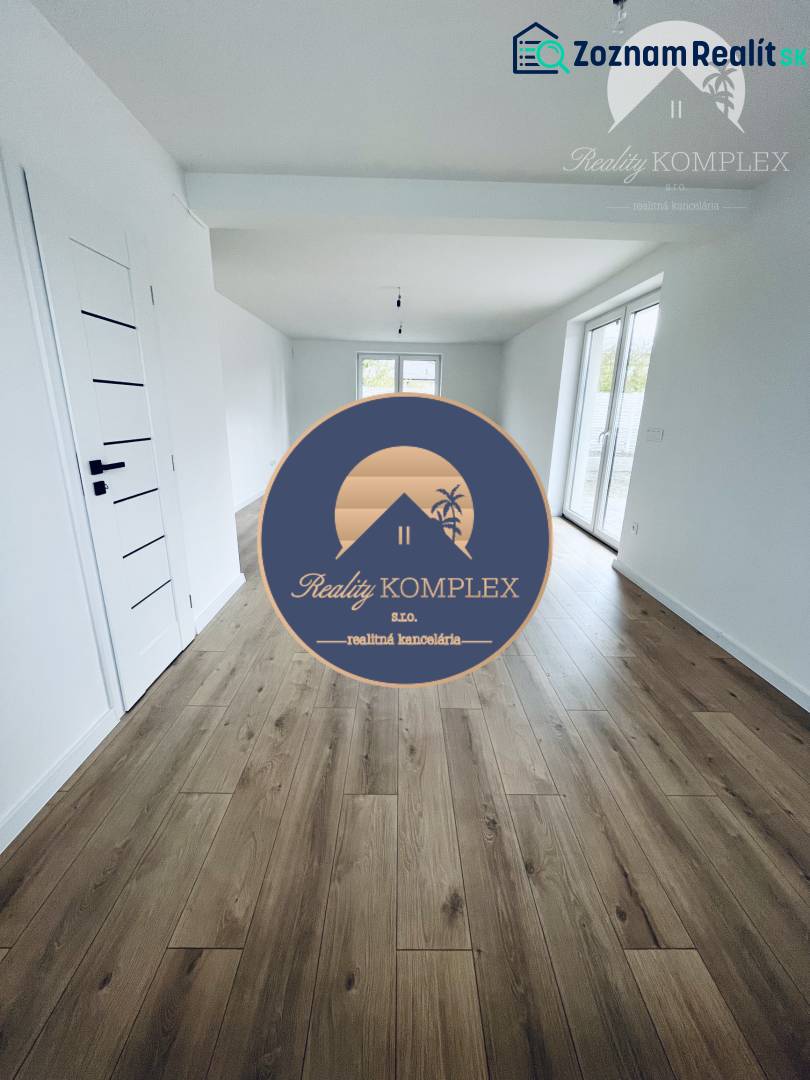 Interior of a family house with white walls and a wooden decor floor.