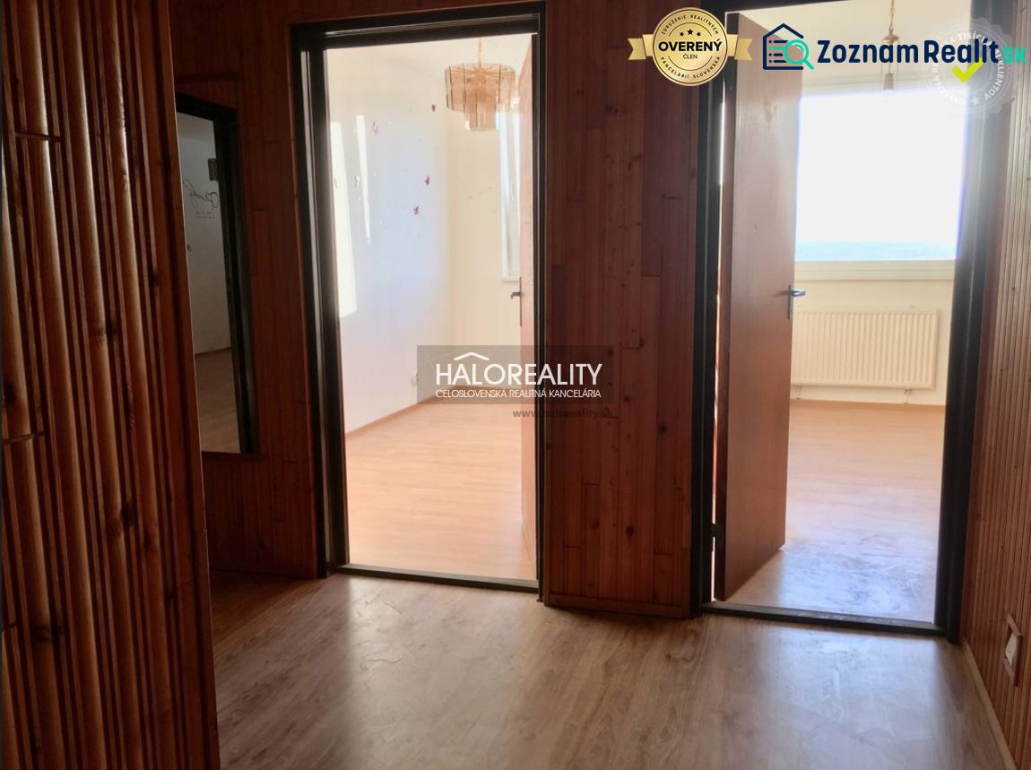 Interior of a 4-room apartment with a wooden decor floor and bright rooms.