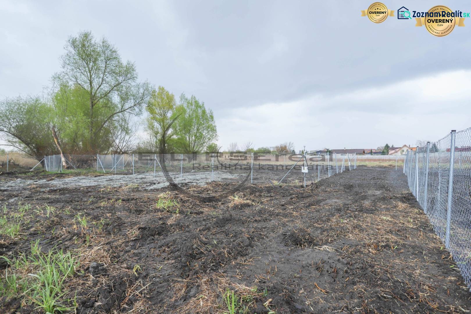 Plots - housing on Nad potokom street in Zohor, fenced area with trees.