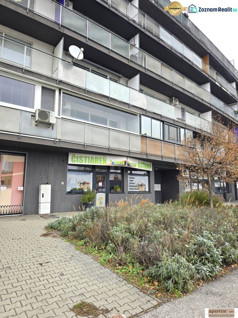 Commercial premises on Vrakunska Street in Bratislava - Podunajske Biskupice, with greenery in front of the building.