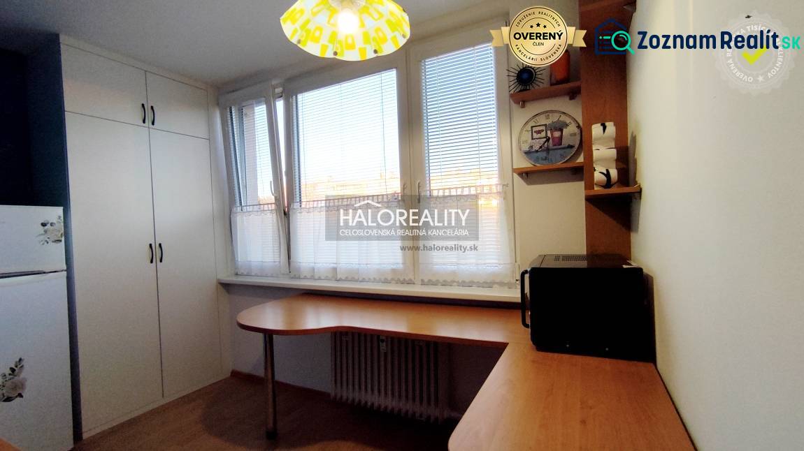 Kitchen and a 2-room apartment, containing furniture, a microwave, and cabinets with storage space.