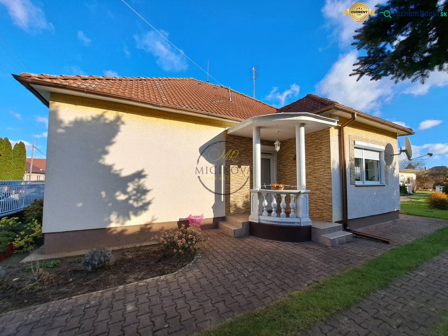 A family house on Bernolákova Street in Vráble with a brick roof and a garden.