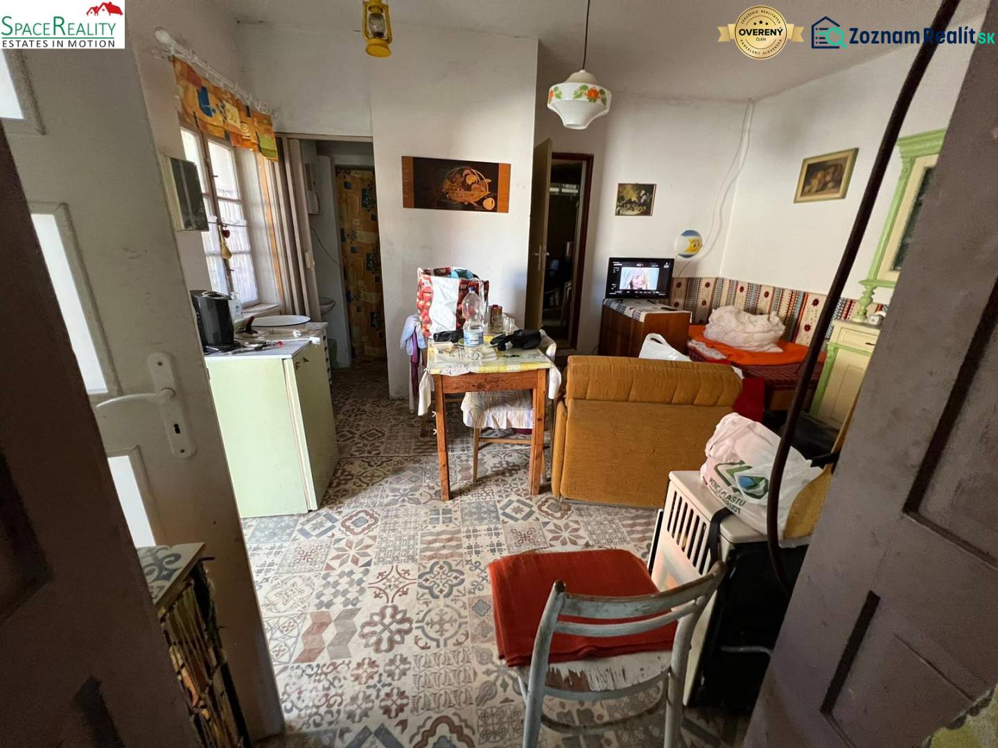 Interior of a family house with retro decor and decorative flooring. Rustic furniture and a stove.