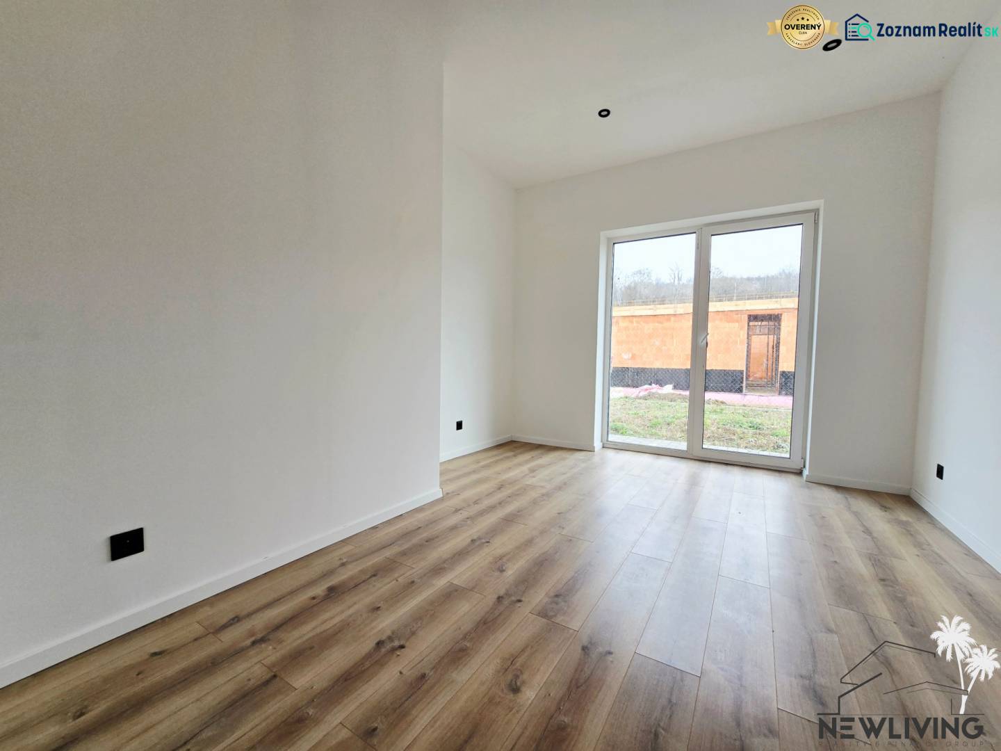 A family house with a wood-decor floor and large windows to the garden.