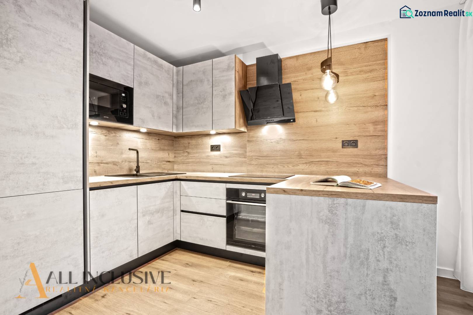 A kitchen in a 2-room apartment with a wood-decor floor and wood paneling.