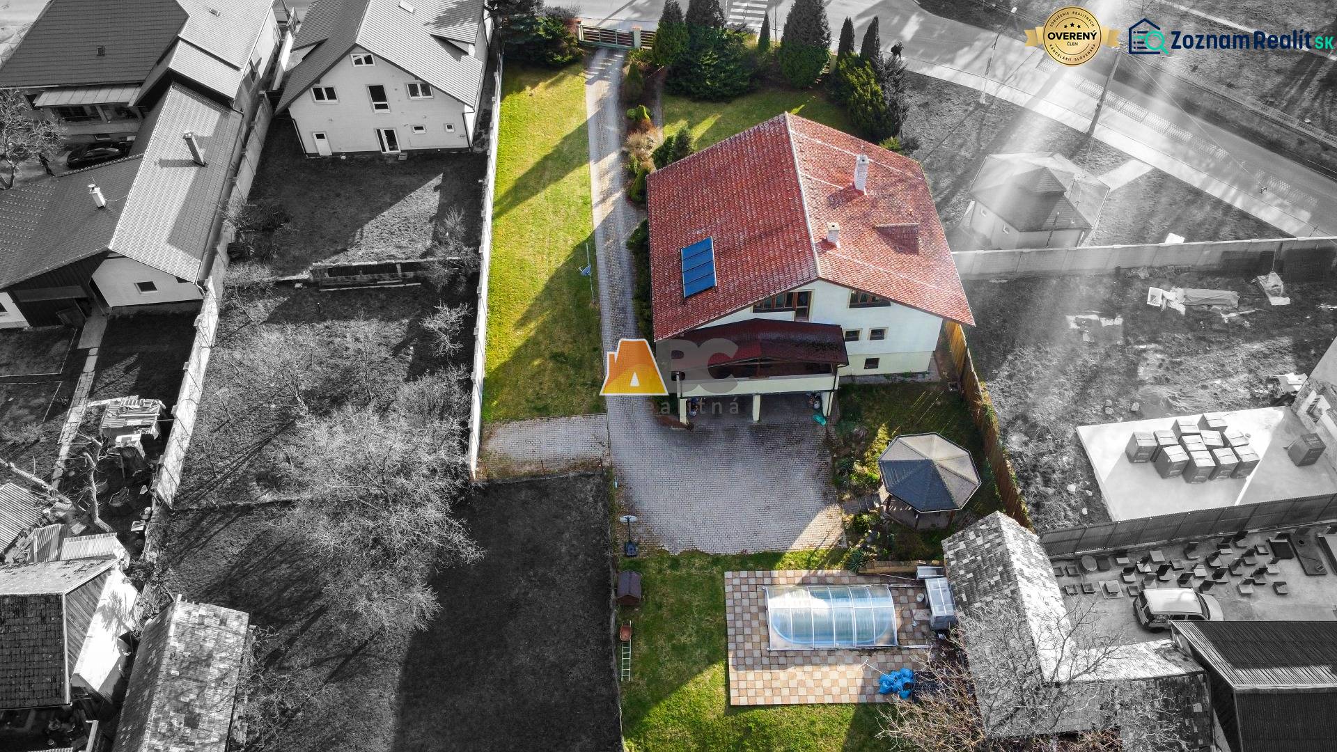 Aerial view of a villa on Andreja Sládkoviča Street in Žarnovica with a yard and a swimming pool.