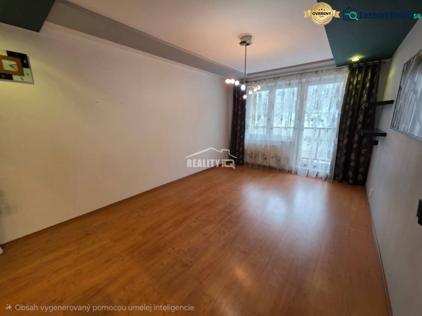 Living room of a 4-room apartment with a wooden decor floor and a large window.