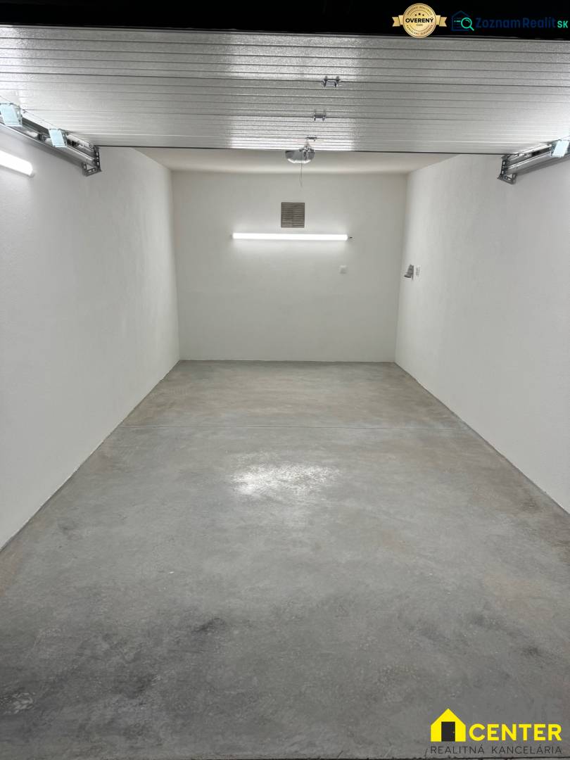 A spacious garage with white walls and a concrete floor in the Garage on Slnečná, Komárno.