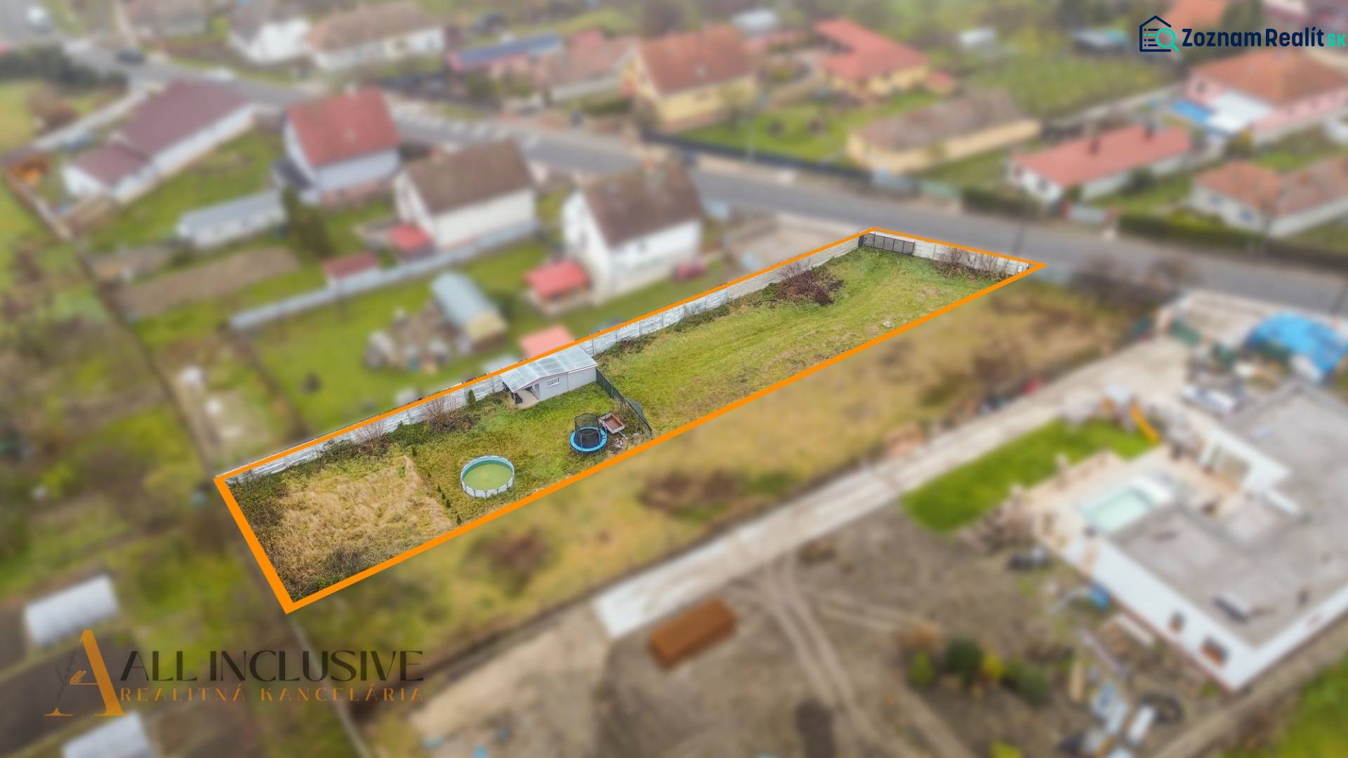 Plots - living in Jahodná: fenced plot with lawn and garden equipment.