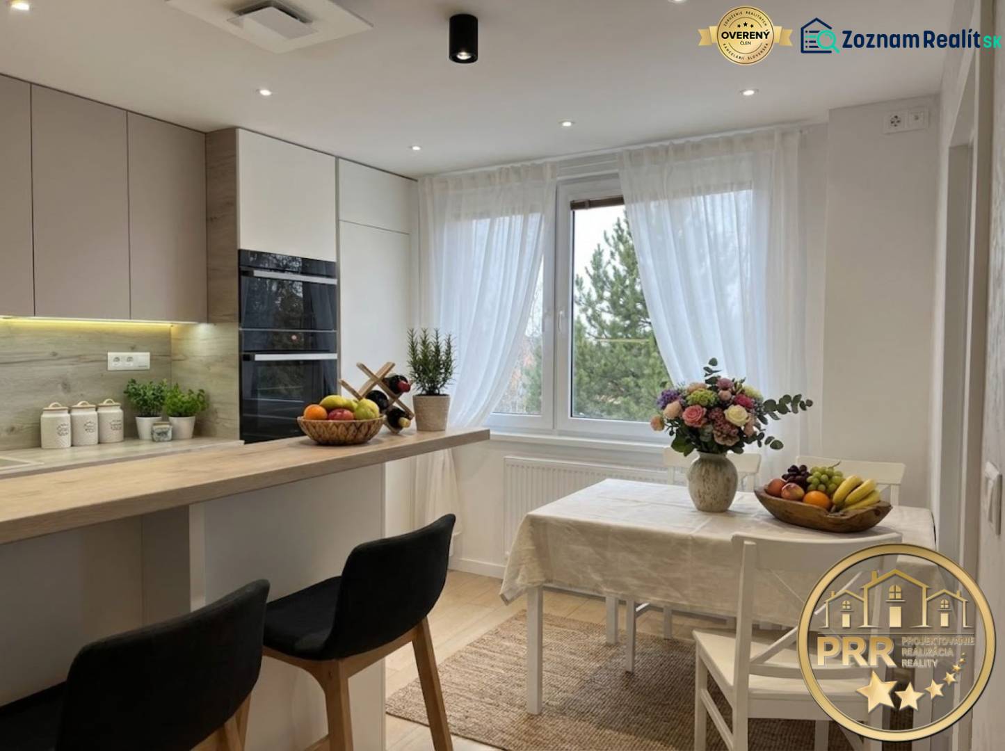 Bright kitchen in a 3-room apartment with a large window and a table, wood decor.